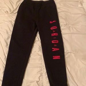 Jordan black and red sweat pants.